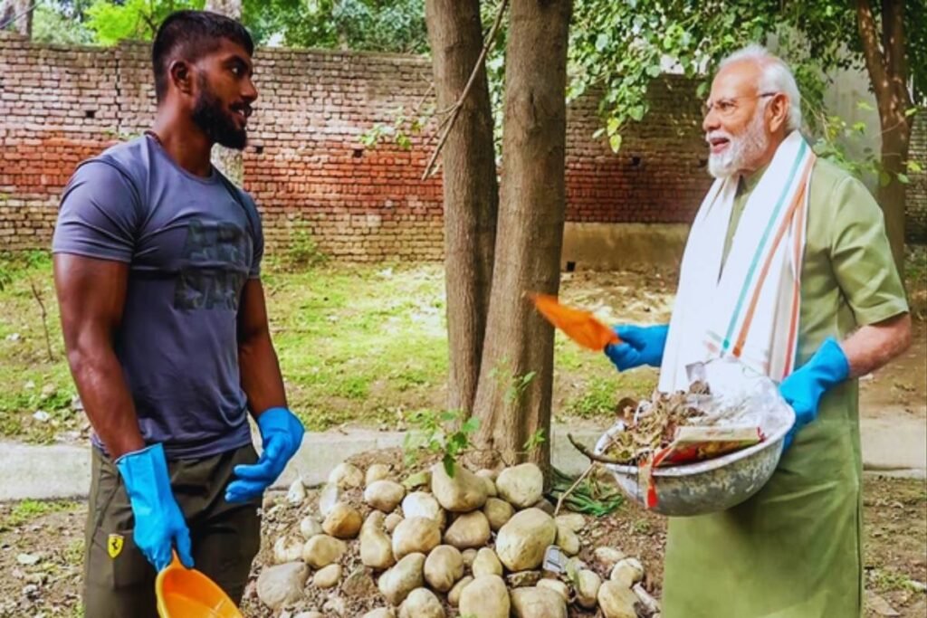 Ankit Baiyanpuria helping PM Modi.